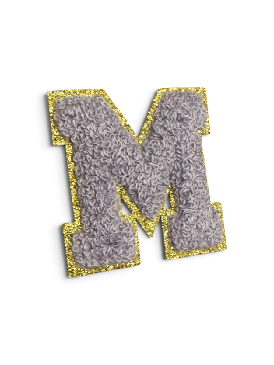 M Klebe-Buchstaben